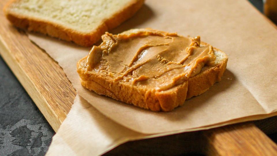 Slice of bread with peanut butter on the top