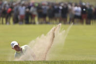 Northern Ireland's Rory McIlroy plays out of a bunker on the 7th green during the second round of the British Open Golf Championship at Royal St George's golf course Sandwich, England, Friday, July 16, 2021. (AP Photo/Ian Walton)