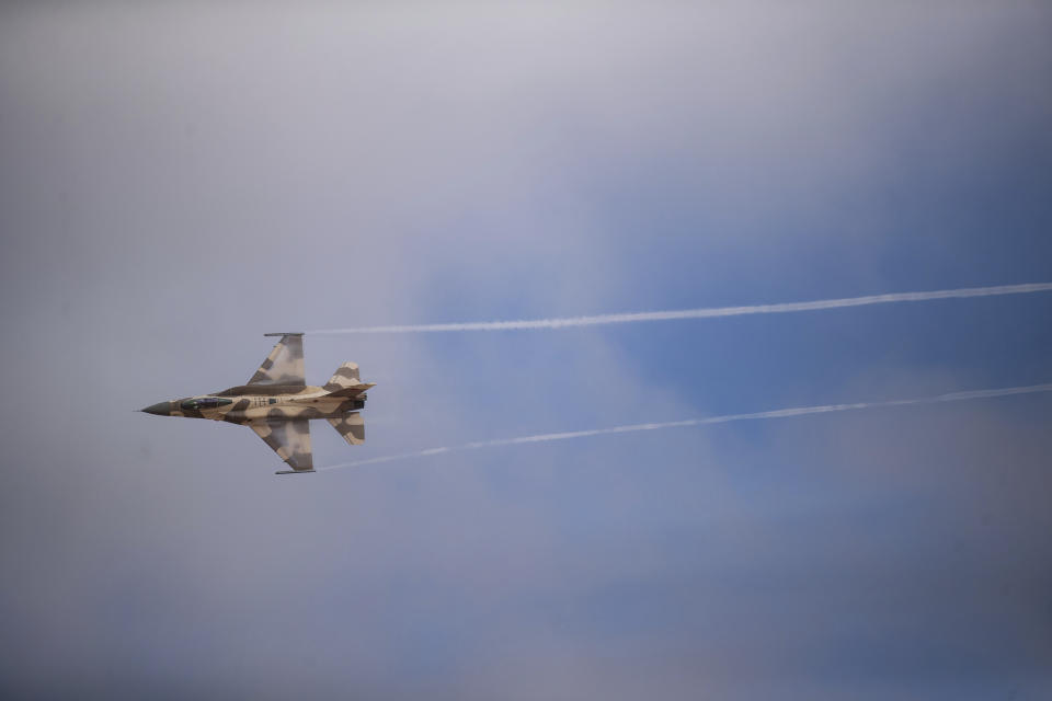 A Moroccan F16 fighter jet performs a maneuver as part of the African Lion military exercise, in Tantan, south of Agadir, Morocco, Friday, June 18, 2021. The U.S.-led African Lion war games, which lasted nearly two weeks, stretched across Morocco, a key U.S, ally, with smaller exercises held in Tunisia and in Senegal, whose troops ultimately moved to Morocco. (AP Photo/Mosa'ab Elshamy)