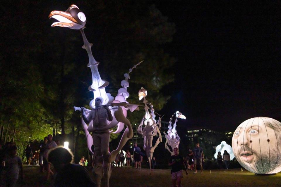 The scene at last year’s Charlotte International Arts Festival in Ballantyne’s Backyard, featuring Birdmen, Mentalgassi and Amanda Parer’s “Man.” All three will be back this year, with Parer debuting giant humanoids.