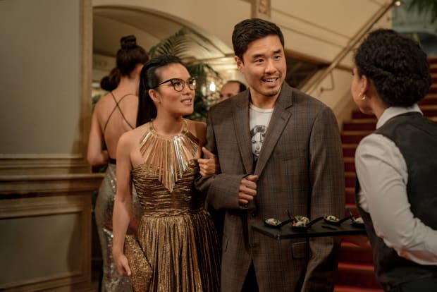 Sasha in Michael Kors and Marcus (Randall Park) in Angry Asian Man merch and an intentionally bad blazer. Photo: Ed Araquel/Netflix