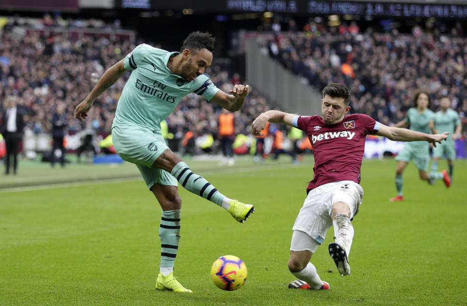 Arsenal's Pierre-Emerick Aubameyang attempts a shot during the English Premier League soccer match between West Ham United and Arsenal at London Stadium in London, Saturday, Jan. 12, 2019. (AP Photo/Tim Ireland)