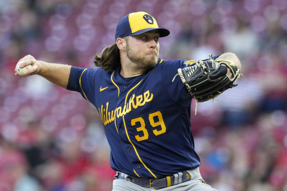 FILE - Milwaukee Brewers starting pitcher Corbin Burnes (39) throws during a baseball game against the Cincinnati Reds on Sept. 24, 2022, in Cincinnati. Two-time All-Star Corbin Burnes and the Milwaukee Brewers went to salary arbitration on Tuesday, Feb. 14, 2023, with the sides $740,000 apart. Burnes asked for a raise from $6.55 million to $10.75 million and the Brewers argued for $10.01 million during a hearing. A decision is expected Wednesday. (AP Photo/Jeff Dean, File)