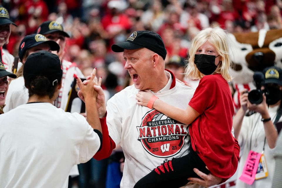Coach Kelly Sheffield celebrates after Wisconsin defeated Nebraska in the championship match of the NCAA women's volleyball tournament Dec. 18, 2021, in Columbus, Ohio.