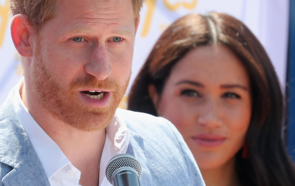 Meghan, Duchess of Sussex looks on as Prince Harry, Duke of Sussex speaks during a visit a township to learn about Youth Employment Services on October 02, 2019 in Johannesburg, South Africa..  (Photo by Chris Jackson/Getty Images)