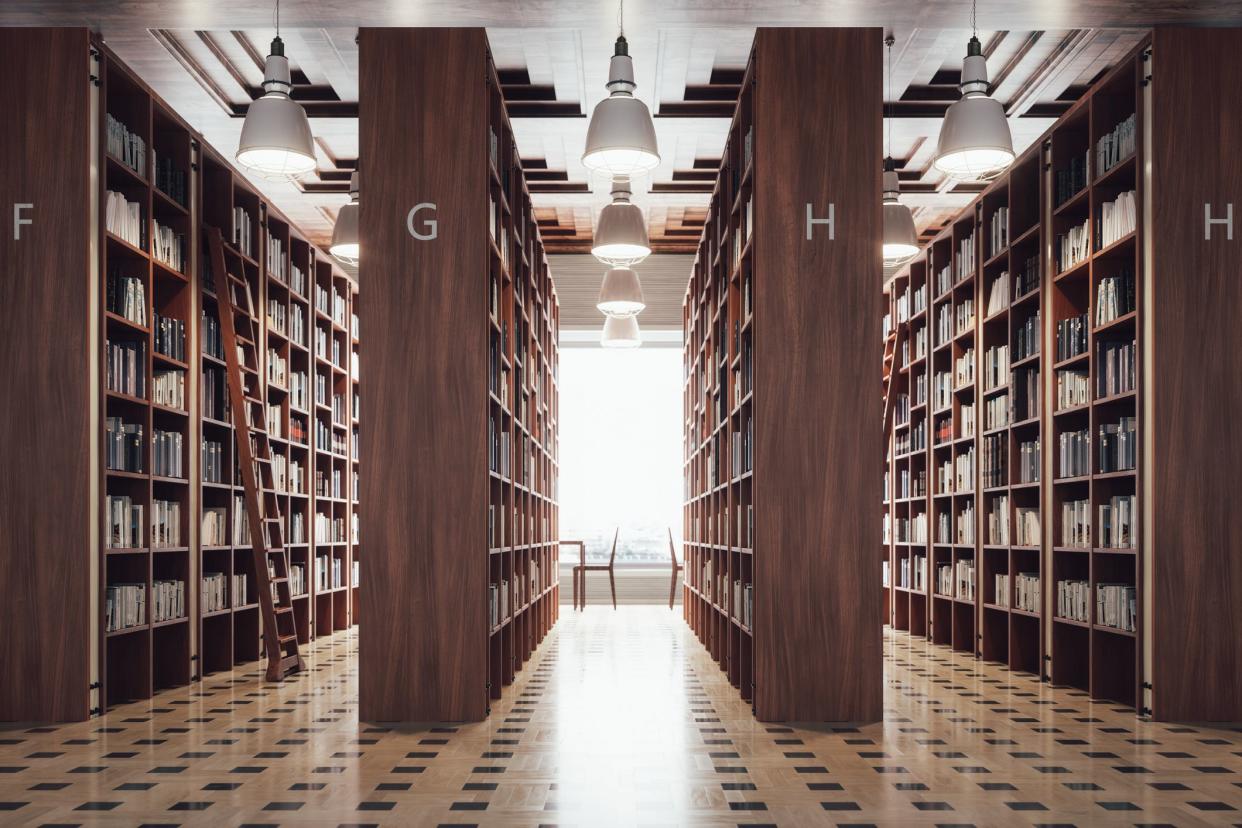 Interior of a large modern library with bookshelves.