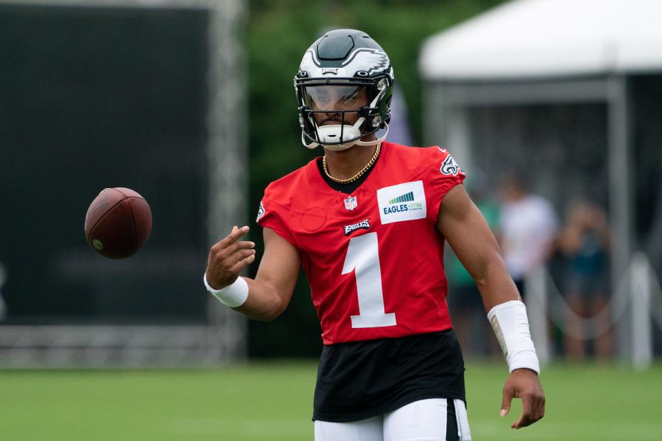 Philadelphia Eagles quarterback Jalen Hurts tosses a ball during training camp.