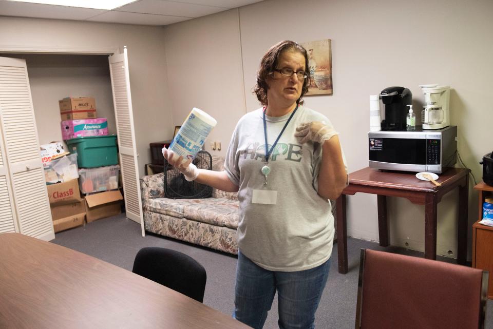 Mary Ridgell volunteers at There Is Hope Rehabilitation Living Facility in Pensacola on Nov. 18. Ridgell, who was once homeless, volunteers at the shelter to give back and provide inspiration to others.