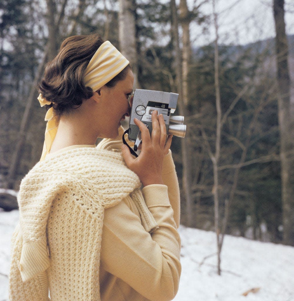 a young woman filming with a wollensak eyematic 8mm movie camera on the slopes of the sugarbush mountain ski resort in warren, vermont, usa, circa 1960 the sugarbush resort is one of the largest ski resorts in new england photo by slim aaronsgetty images