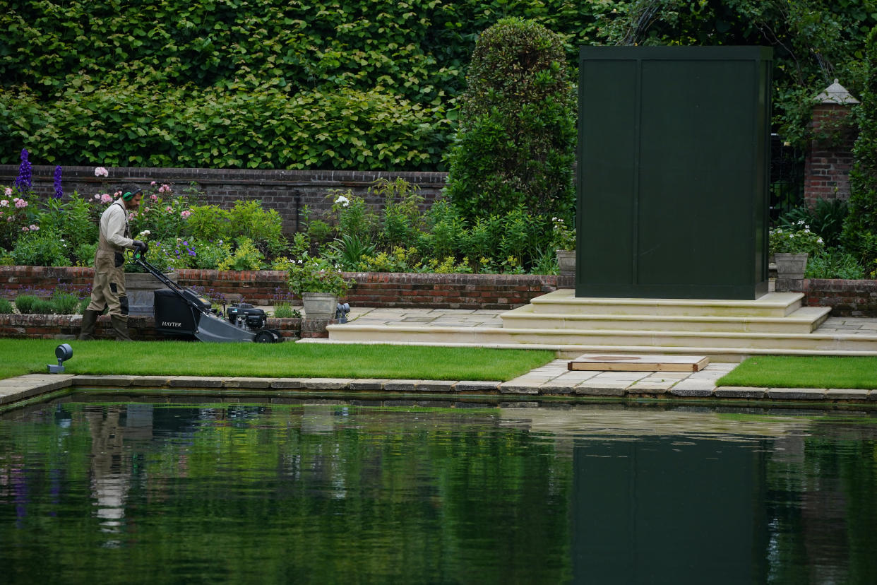 A gardener works in the Sunken Garden at Kensington Palace, London, the former home of Diana, Princess of Wales, where her sons, the Duke of Cambridge and the Duke of Sussex, will put their differences aside when they unveil a statue in her memory on what would have been her 60th birthday. Picture date: Wednesday June 30, 2021. (Photo by Aaron Chown/PA Images via Getty Images)