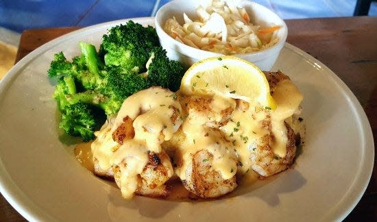 Crab-stuffed mahi mahi with golden lobster sauce at Puddle Jumpers.