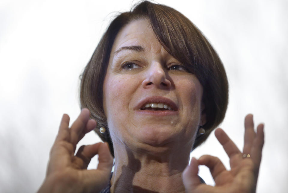 FILE - In this Feb. 24, 2019 file photo U.S. Sen. Amy Klobuchar, D-Minn., speaks to voters during a campaign stop at a home, in Nashua, N.H. Klobuchar, supports legalization and believes states should have the right to determine how to handle marijuana regulation within their borders but hasn't signed on to New Jersey Sen. Cory Booker's legislation. (AP Photo/Steven Senne, File)