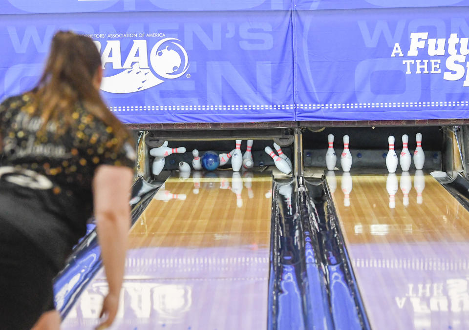 Maria Bulanova, a member of the Professional Women's Bowling Association and an assistant bowling coach at St. Francis College, practices at Kingpin's Alley and Family Center, Wednesday, June 15, 2022, in Glens Falls, N.Y. Title IX has opened the door for thousands of female athletes from abroad to get an American education and a shot at a life and career in the United States. (AP Photo/Hans Pennink)