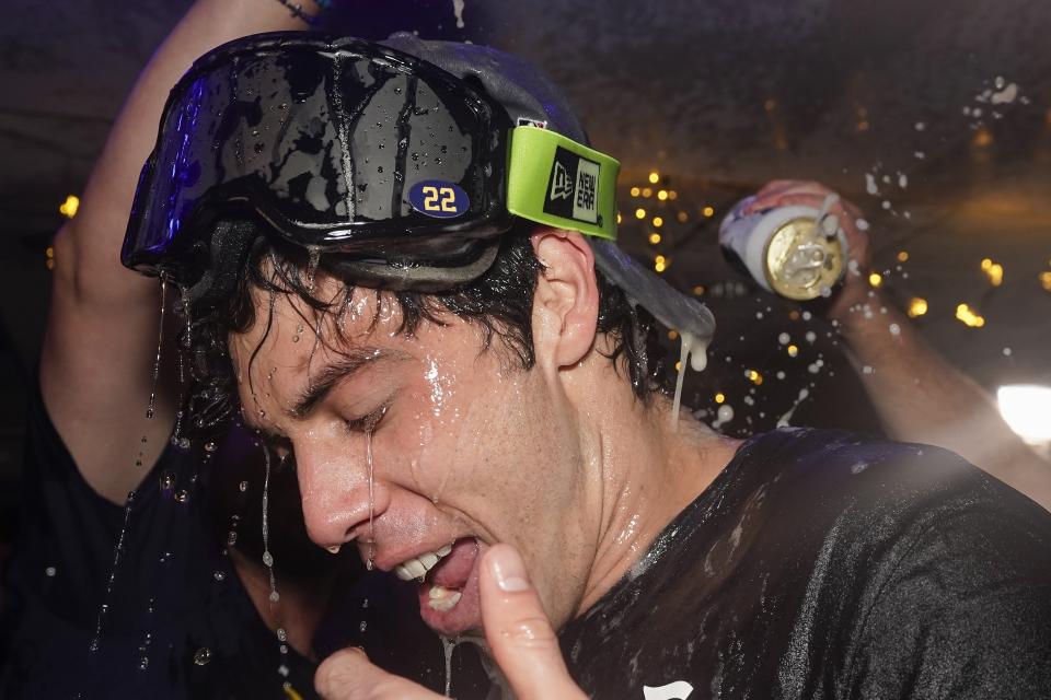 Milwaukee Brewers' Christian Yelich celebrates after clinching the National League Central Division after a baseball game against the St. Louis Cardinals Tuesday, Sept. 26, 2023, in Milwaukee. (AP Photo/Morry Gash)