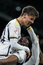 Real Madrid's Arda Guler celebrates with his teammates after scoring his side's fourth goal the Spanish La Liga soccer match between Real Madrid and Celta Vigo at the Santiago Bernabeu stadium in Madrid, Spain, Sunday, March 10, 2024. (AP Photo/Manu Fernandez)