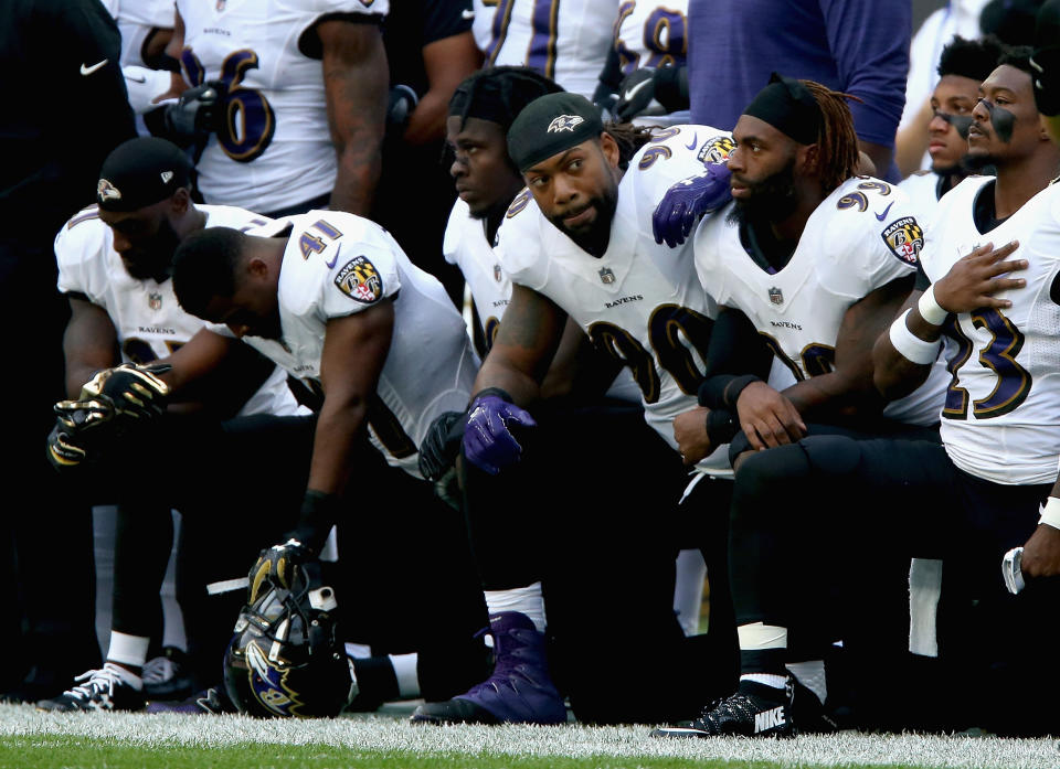 Baltimore Ravens players kneel for the American National anthem during the NFL International Series match between Baltimore Ravens and Jacksonville Jaguars at Wembley Stadium on September 24, 2017 in London, England. (Photo by Alex Pantling/Getty Images)