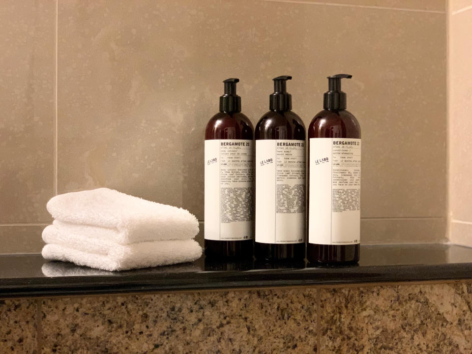 This undated image provided by Hyatt shows multi-use bottles. Hyatt Hotels Corp. is the latest hotel company to remove small bottles from its bathrooms in an effort to reduce waste. Hyatt says it is shifting to large, multi-use bottles for shampoo, conditioner, bath gel and lotion at its 875 hotels worldwide. (Courtesy of Hyatt via AP)