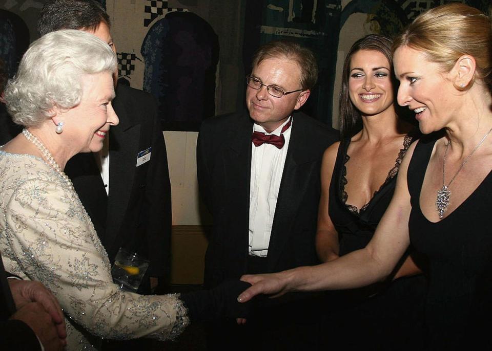 Kirsty Gallacher and Gabby Logan pictured together meeting Queen Elizabeth in 2013 (Getty Images)