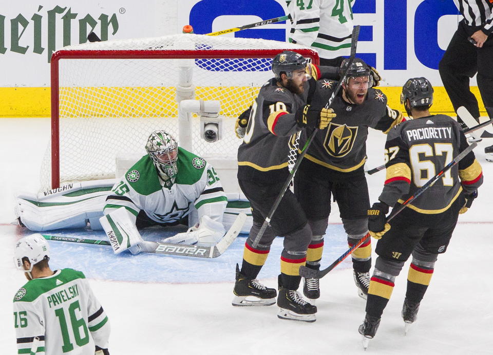 Dallas Stars goalie Anton Khudobin (35) watches as Vegas Golden Knights' Nicolas Roy (10), Paul Stastny (26) and Max Pacioretty (67) celebrate a goal during the second period of Game 2 of the NHL hockey Western Conference final, Tuesday, Sept. 8, 2020, in Edmonton, Alberta. (Jason Franson/The Canadian Press via AP)