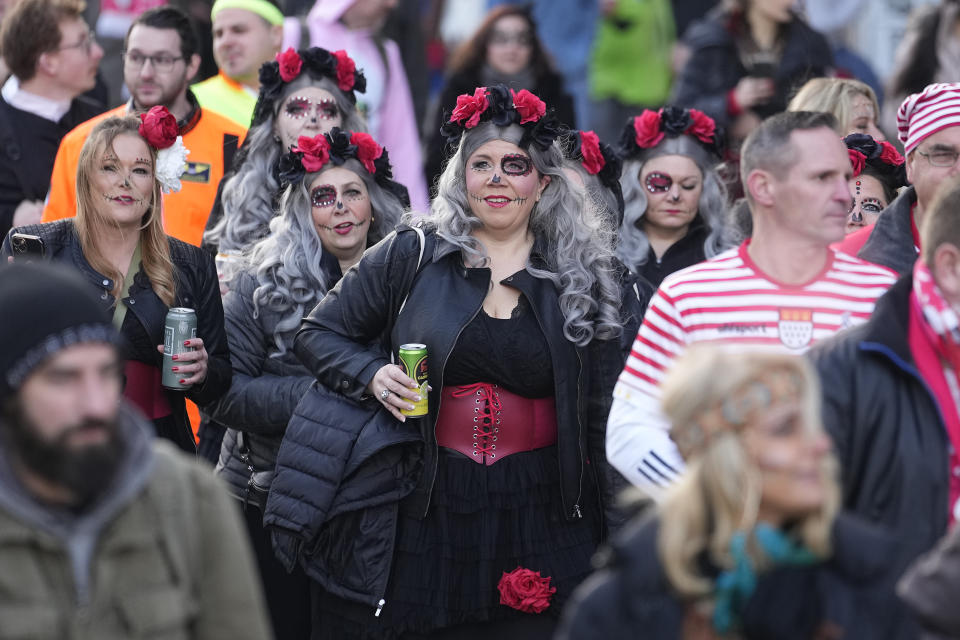 Revellers arrive in the city center at the start of the street carnival in Cologne, Germany, Thursday, Feb. 16, 2023. Hundreds of thousands will celebrate the carnival without any coronavirus restrictions in the streets of the German carnival capital. (AP Photo/Martin Meissner)