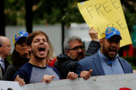 Protesters demonstrate outside of Goldman Sachs headquarters after the company purchased Venezuelan bonds in New York, U.S., May 30, 2017. REUTERS/Lucas Jackson