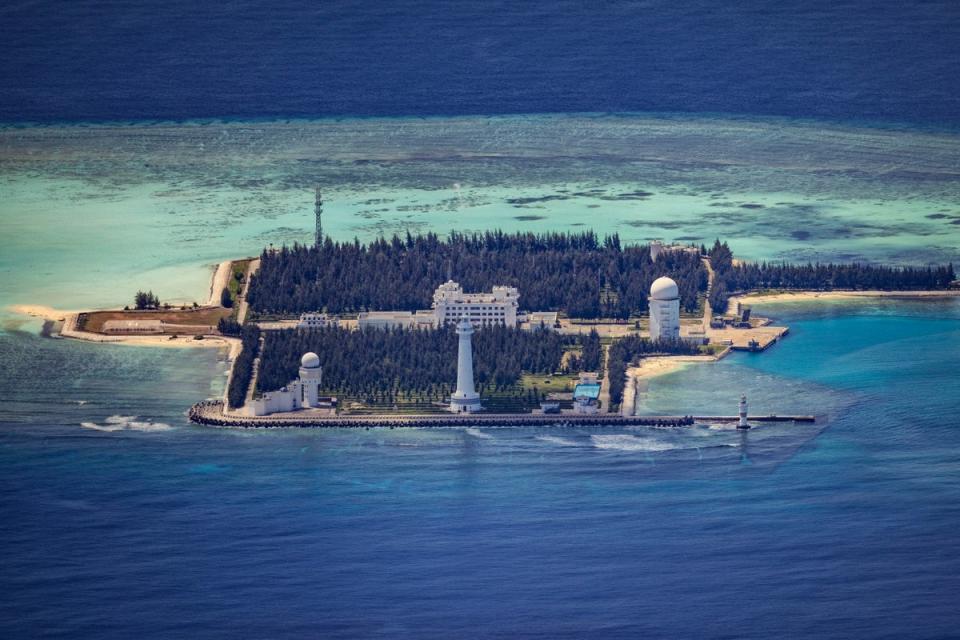 Buildings and structures are seen on the artificial island built by China in Cuarteron Reef on 25 October 2022 in Spratly Islands, South China Sea. China has progressively asserted its claim of ownership over disputed islands in the South China Sea by artificially increasing the size of islands, creating new islands and building ports, military outposts and airstrips. The South China sea is an important trade route and is of significant interest as geopolitical tensions remain high in the region (Getty Images)