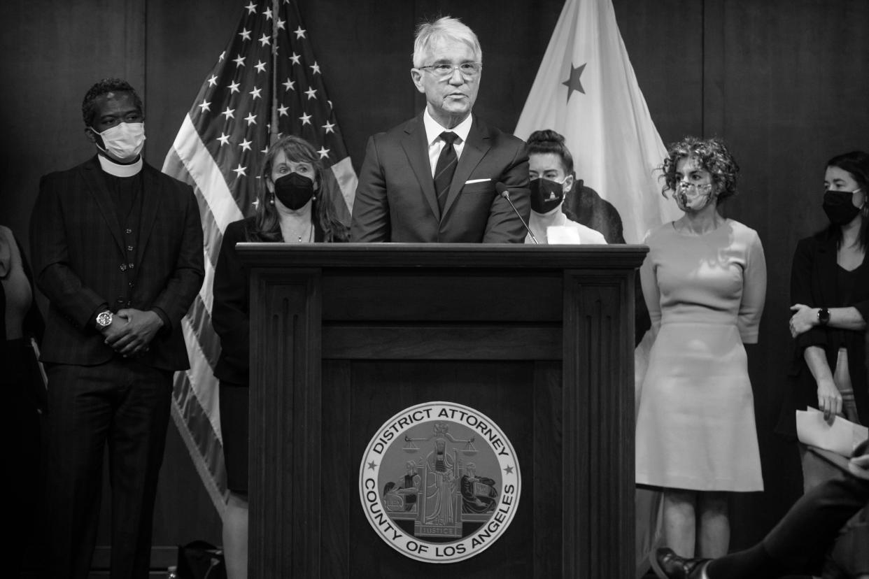 With prosecutors from around the country behind him, George Gascón holds a press conference.