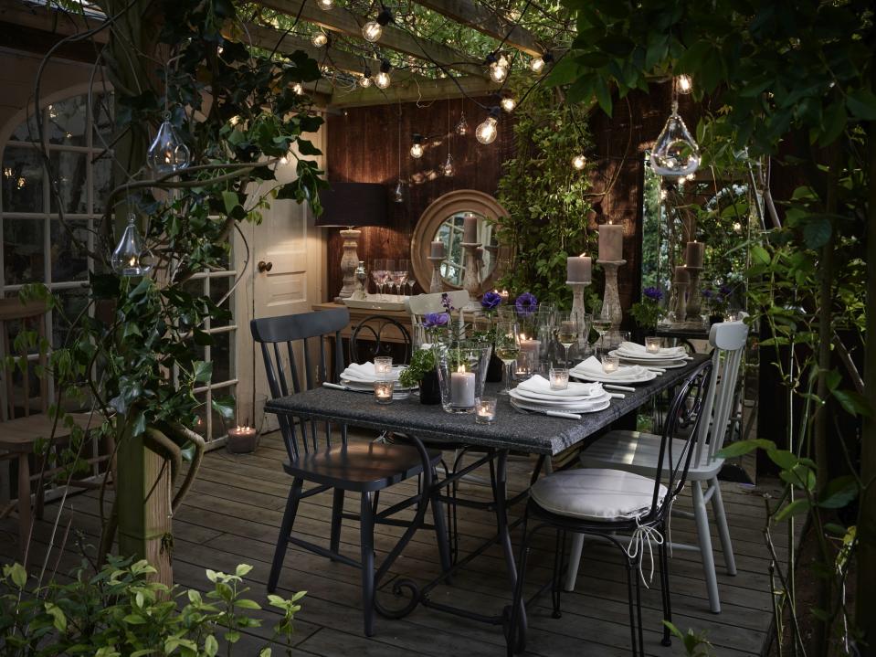 14. Create an outdoor dining area under a pergola