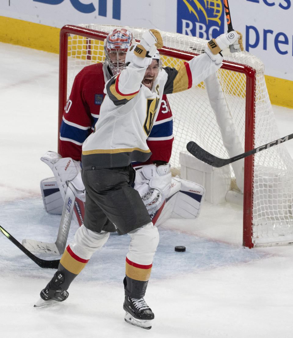 Vegas Golden Knights' Mark Stone (61) celebrates a goal on Montreal Canadiens goaltender Cayden Primeau (30) during the third period of an NHL hockey game Thursday, Nov. 16, 2023, in Montreal. (Christinne Muschi/The Canadian Press via AP)