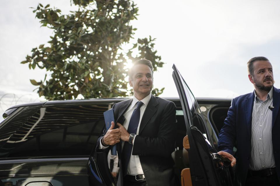 Greece's Prime Minister and New Democracy leader Kyriakos Mitsotakis arrives for an interview at Alpha television station during his election campaign in Athens, Greece, Tuesday, April 25, 2023. (AP Photo/Thanassis Stavrakis)