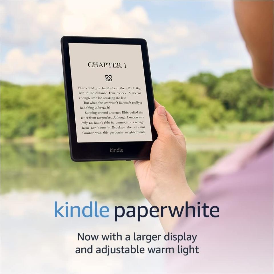 model holding kindle paperwhite