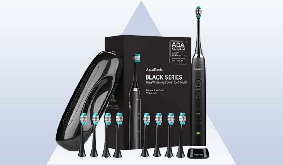black electric toothbrush with box, case and multiple brush heads