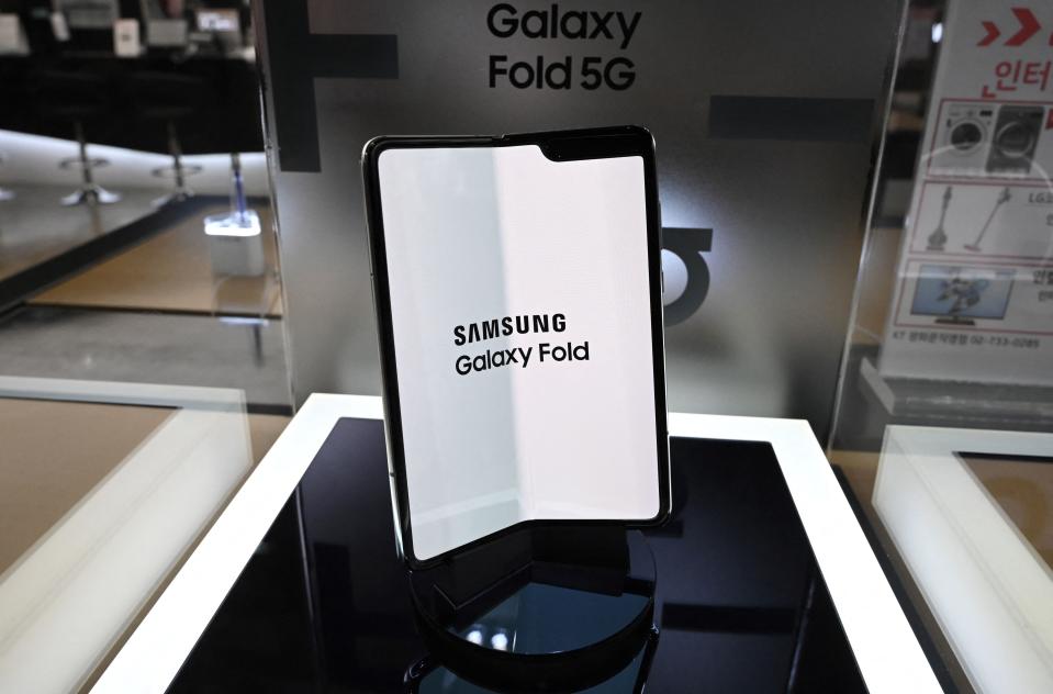 Samsung's Galaxy Fold 5G smartphone is displayed at a telecom shop in Seoul on January 8, 2020. Samsung Electronics' operating profits fell by more than a third in the fourth quarter, the world's biggest manufacturer of smartphones and memory chips estimated on January 8.