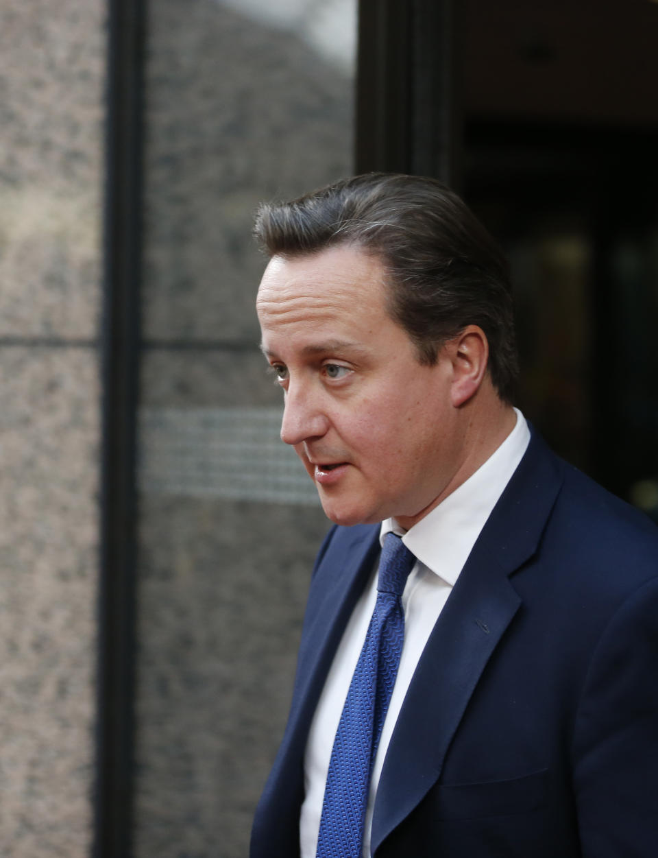 British Prime Minister David Cameron leaves the building after a bilateral meeting at an EU summit in Brussels on Thursday, Nov. 22, 2012. EU leaders begin what is expected to be a marathon summit on the budget for the years 2014-2020. The meeting could last through Saturday and break up with no result and lots of finger-pointing. (AP Photo/Michel Euler)