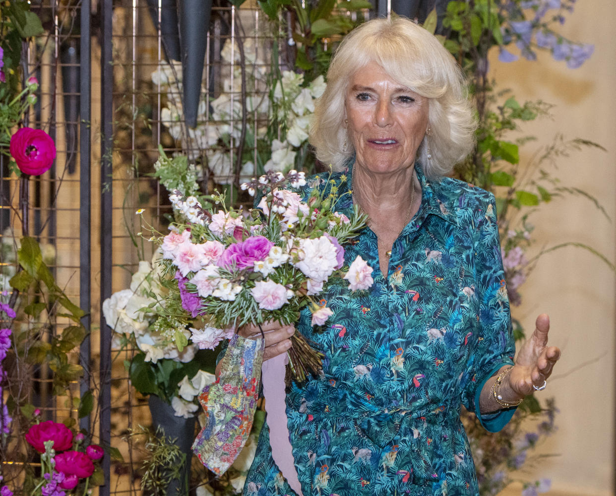 The Duchess of Cornwall holds a bouquet containing rosemary, a sign of remembrance, acknowledging that today would have been the 100th birthday of the Duke of Edinburgh, as she visits the opening of an exhibition of New Covent Garden Market's British Flowers Week in London. Picture date: Thursday June 10, 2021.