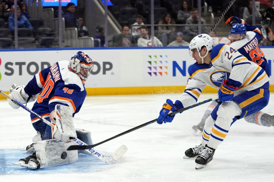 New York Islanders goaltender Semyon Varlamov (40) makes the save against Buffalo Sabres center Dylan Cozens (24) during the third period of an NHL hockey game, Saturday, March 25, 2023, in Elmont, N.Y. The Sabres won 2-0.(AP Photo/Mary Altaffer)