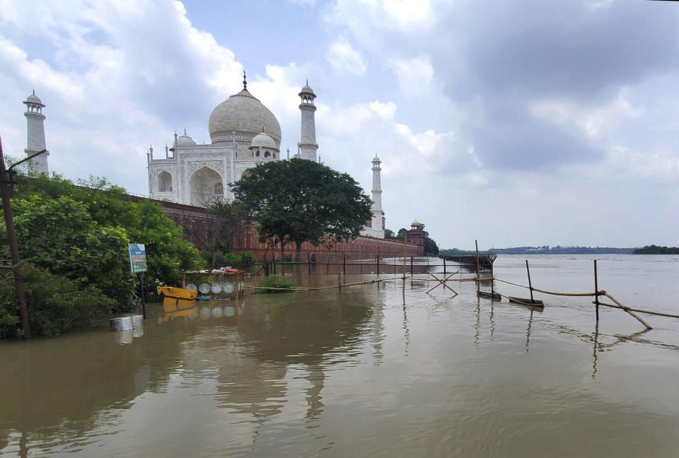 CORRECTS DATE- A swollen Yamuna river rises to the periphery of the Taj Mahal monument in Agra, India, Tuesday, July 18, 2023. (AP Photo/Aryan Kaushik)