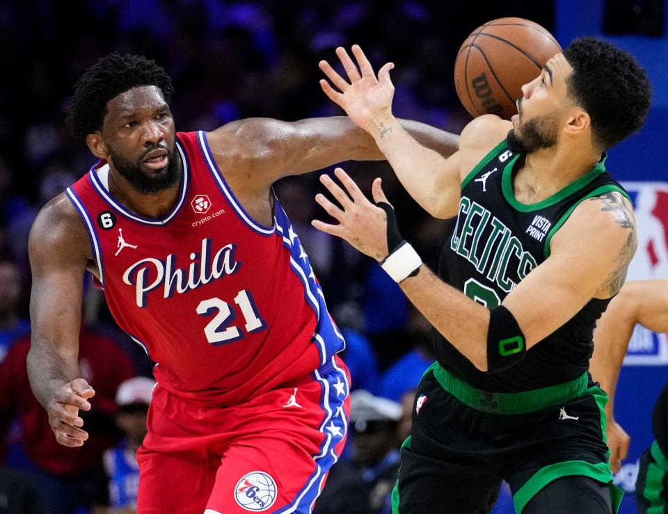 The Celtics' Jayson Tatum, right, knocks the ball away from the 76ers' Joel Embiid during the second half of Game 3 of the Eastern Conference semifinals on Friday.