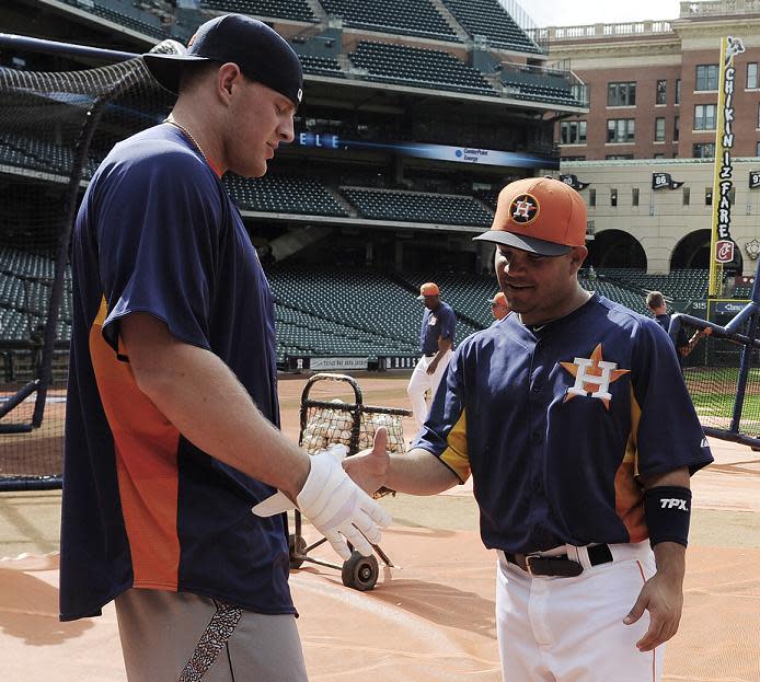 J.J. Watt (L) and Jose Altuve hang out before an Astros exhibition game in 2013. (AP)