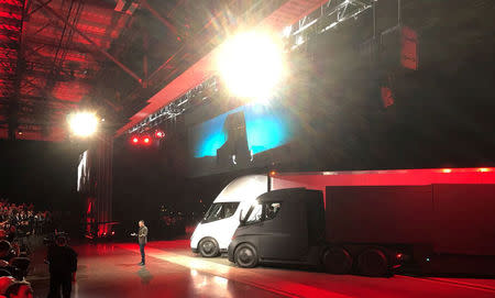 Tesla CEO Elon Musk shows off the Tesla Semi as he unveils the company's new electric semi truck during an presentation in Hawthorn, California, U.S., November 16, 2017. REUTERS/Alexandria Sage