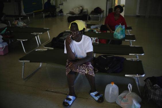 In Bahamas, authorities set up 14 shelters including one in Freeport on Grand Bahama (AP)