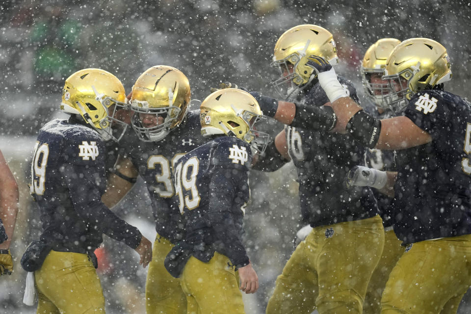 Notre Dame place kicker Blake Grupe (99) reacts with teammates after kicking an extra point during the second half of an NCAA college football game against Boston College, Saturday, Nov. 19, 2022, in South Bend, Ind. Notre Dame won 44-0. (AP Photo/Darron Cummings)