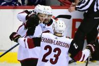 Feb 21, 2019; Vancouver, British Columbia, CAN; Arizona Coyotes defenseman Jakob Chychrun (6) celebrates with defenseman Oliver Ekman-Larsson (23) and forward Alex Galchenyuk (17) after scoring a goal against Vancouver Canucks goaltender Jacob Markstrom (not pictured) during the third period at Rogers Arena. Mandatory Credit: Anne-Marie Sorvin-USA TODAY Sports