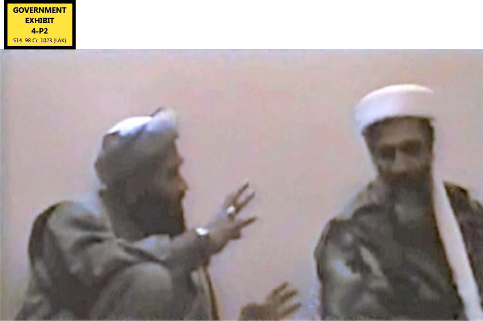 In this undated Photo provided by the United States Attorney’s Office for the Southern District of New York, defendant Suliman Abu Ghayth, left, gestures toward al-Qaida founder Osama Bin Laden, in a room somewhere in Afghanistan. Abu Ghayth, Bin Laden’s son-in-law, is being tried in New York for plotting to kill Americans by being a motivational speaker at al-Qaida training camps before the Sept. 11 attacks. He was also a spokesman for the terror group after Sept. 11, 2001, when it sought to recruit more militants to its cause. (AP Photo/US Attorney’s Office for the Southern District of New York)