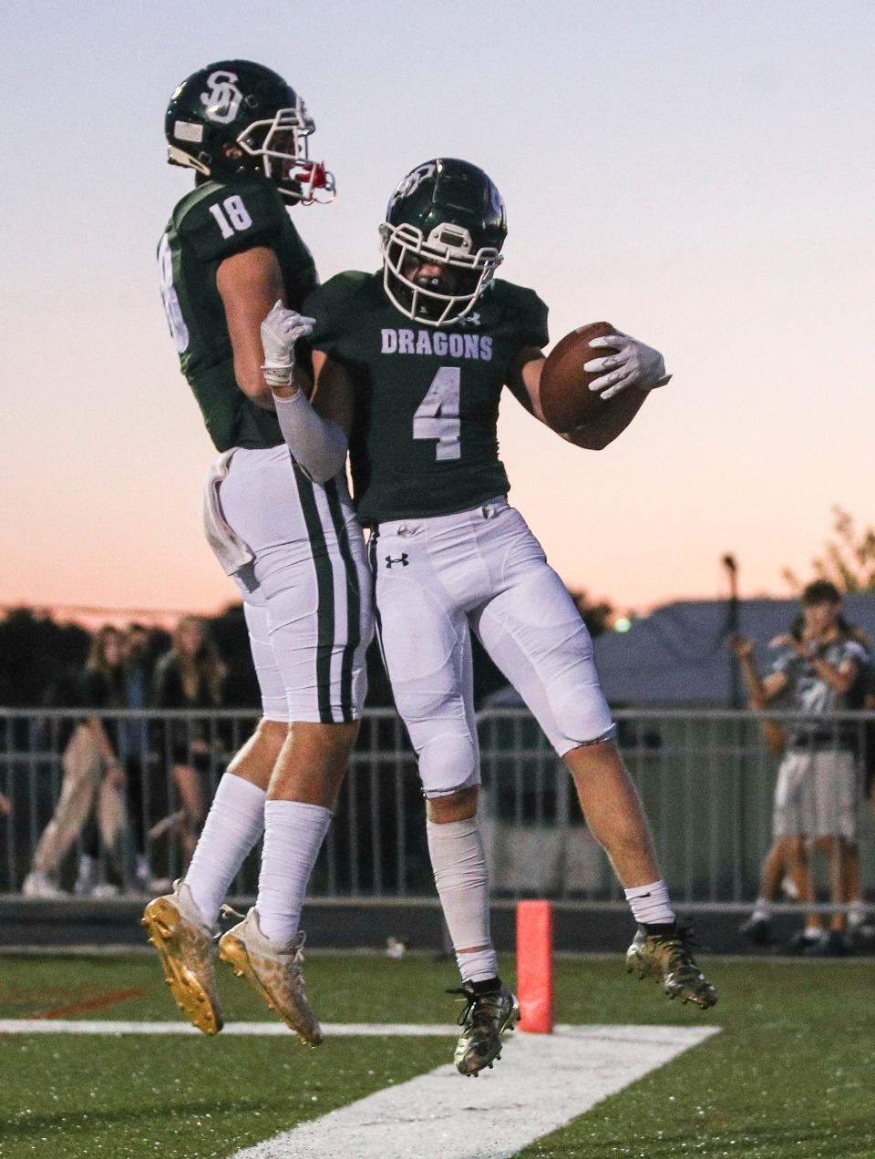 South Oldham's Jeffrey Burton, right, celebrates after his touchdown with teammate Andrew Farr while playing against Atherton in Friday night football at South Oldham High School. Sept. 30, 2022