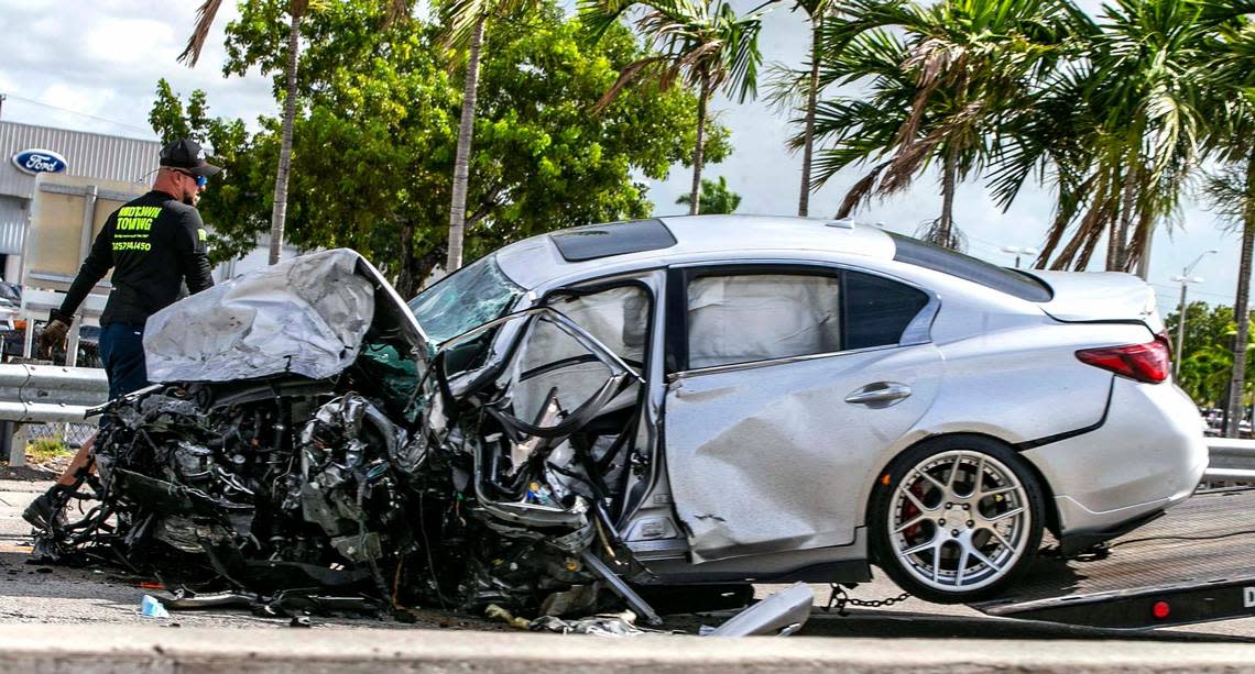 The Silver Infinit sedan involved in a wrong way accident on the Palmetto Expressway that killed five is prepared to be towed on Saturday August 20, 2022.