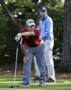 Matt Kuchar, right, and Louis Oosthuizen, of South Africa, watch Ossthuizen's drive on the second hole during the second round of the Masters golf tournament Friday, April 11, 2014, in Augusta, Ga. (AP Photo/David J. Phillip)
