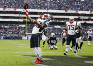 <p>New England Patriots Dion Lewis celebrates after scoring a touchdown against the Oakland Raiders during the first half of their 2017 NFL Mexico Game at the Estadio Azteca in Mexico City, Nov. 19, 2017. (Photo by Jessica Rinaldi/The Boston Globe via Getty Images) </p>