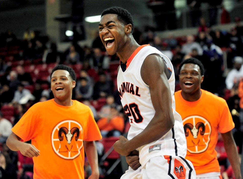 Manual's Da'Monte Williams (20) gets pumped up during player introductions before a 2015 game against city rival Peoria High at the River City Shootout at Renaissance Coliseum.