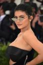 <p>Jenner hit the Met Gala red carpet in 2018 wearing a casual chignon and retro-glam makeup.</p>